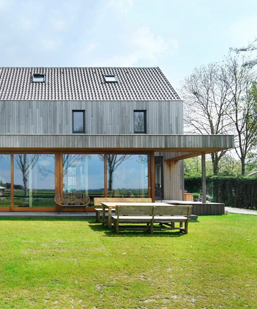 reclaimed wood assembles HOYT architecten's barn house in waterland