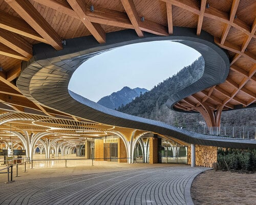 jiuzhai valley visitor center is a fluid extension of the national park's landscape